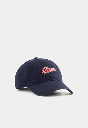 Navy blue baseball cap with curved brim featuring red and white "Gant" embroidered logo on the front center.