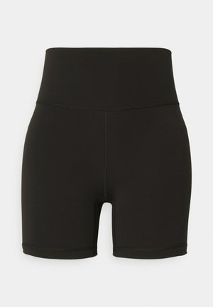 Shorts de ciclism negri, cu talie înaltă, dintr-un material elastic, cu un design fără cusături și accente cusute, terminându-se deasupra genunchiului.