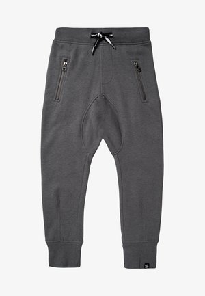 Pantalon de survêtement pour enfants gris foncé avec taille élastique, cordon de serrage noir et blanc, poches avant zippées et bords-côtes aux chevilles.