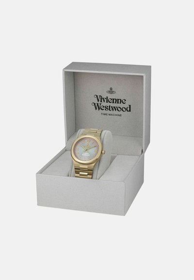 Goudkleurig horloge met een ronde schijf, lichtblauwe wijzerplaat en gouden cijfers, gepresenteerd in een grijze doos met Vivienne Westwood branding.