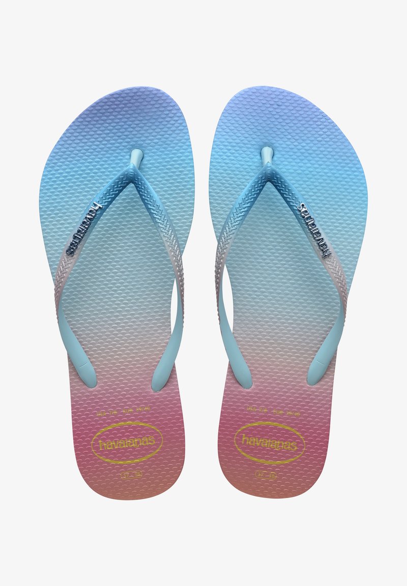 Blue ombre flip-flops with a textured rubber sole, featuring a soft blue thong strap and "havaianas" logo on the left strap.