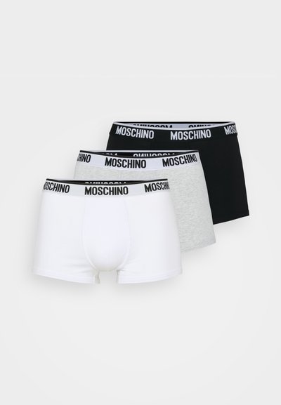 Three boxer shorts in white, gray, and black. Each features a black elastic waistband with "MOSCHINO" in bold white lettering.