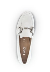 White leather loafer with a rounded toe, stitched detailing, and a silver-tone hardware accent on the upper. Interior features a tan insole.
