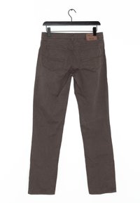 Bruna jeans i denim med en strukturerad mönster, rak bendesign, fem fickor och en läderlogotyp på baksidan av midjan.