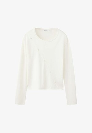 Pull court blanc à manches longues avec encolure ronde et rangée diagonale de petits boutons sur le devant.