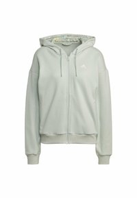 Sweat à capuche zippé gris clair avec cordons, poignets et bas côtelés, logo Adidas sur la poitrine, et doublure intérieure de la capuche à motifs.