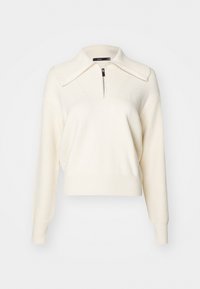 Pull-over blanc avec col zippé, texture côtelée et coupe décontractée. Comprend des manches longues et un corps lisse.