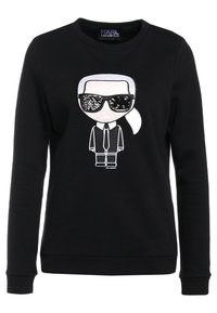 Felpa nera con grafica a cartone animato di una figura con occhiali da sole e giacca. Realizzata in tessuto morbido con polsini e scollatura a coste.