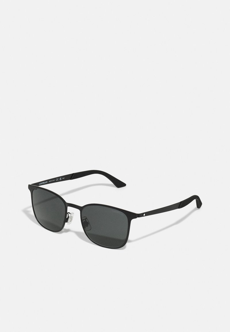 Black sunglasses with a rectangular frame, dark lenses, metal arms, and clear nose pads. Minimalist design with sleek lines.