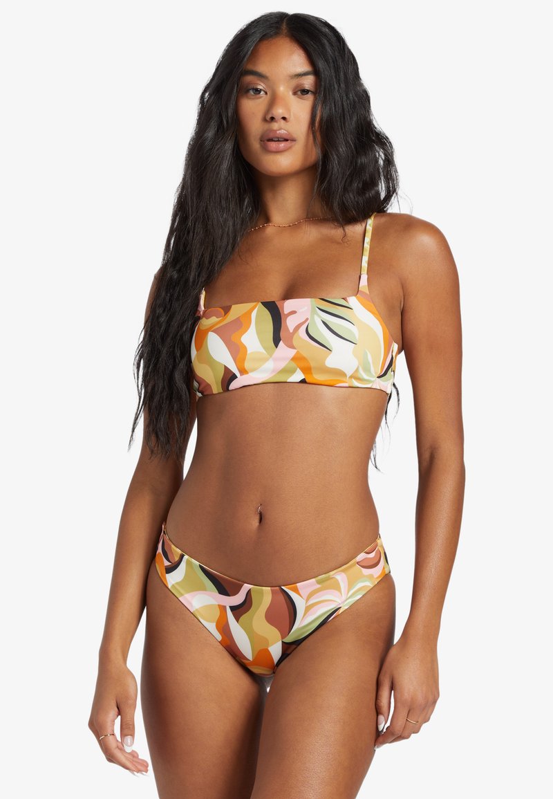Multicolored bikini set with a bandeau top and low-rise bottoms. Features a wavy abstract pattern in peach, green, and brown tones.