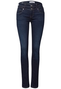 Tmavě modré úzké džíny ze denimu s knoflíkovým a zipovým zapínáním, předními a zadními kapsami a kontrastním prošíváním.