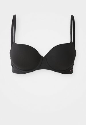 Black padded bra with adjustable straps, smooth texture, underwire support, and a subtle logo detail on the side.