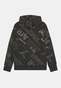 Felpa nera con cappuccio, caratterizzata da un motivo con il testo "JORDAN" giallo e grigio e il logo Jumpman, dotata di tasca a marsupio e polsini a costine.