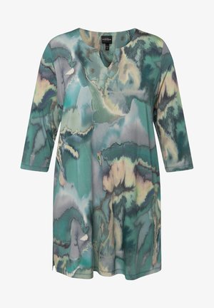 Langärmlige Tunika aus weichem, fließendem Stoff mit einem türkisgrauen Marmor-Muster. Verfügt über einen V-Ausschnitt und Seitenschlitze für mehr Bewegungsfreiheit.