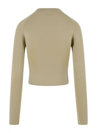 Beige langermet kort topp med rund hals, glatt tekstur og tettsittende design, med flate sømmer og ingen synlige lukkinger.