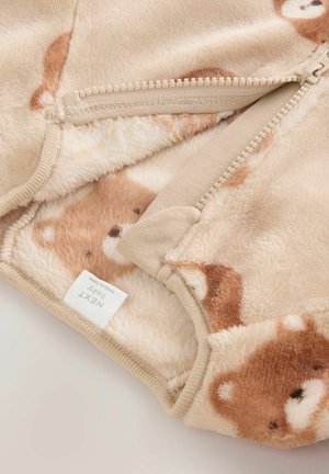 Weiches, beiges Fleece-Oberteil mit Reißverschluss, verziert mit einem Bärenmuster und mit dem Etikett "NEXT Baby".