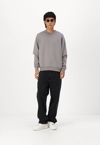 Hollister Co. Vrečaste kavbojke - washed black