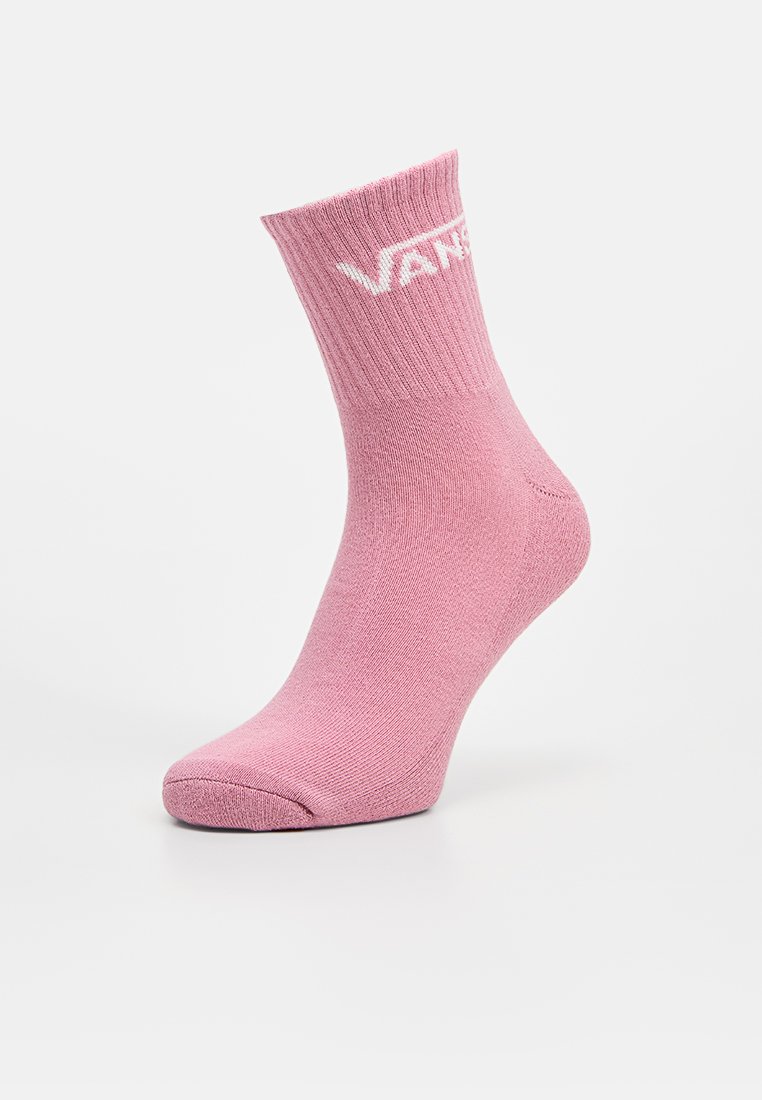 Calzino di cotone rosa con polsino a coste; presenta il logo "VANS" bianco. Lunghezza corta, texture liscia e zona delle dita rinforzata.