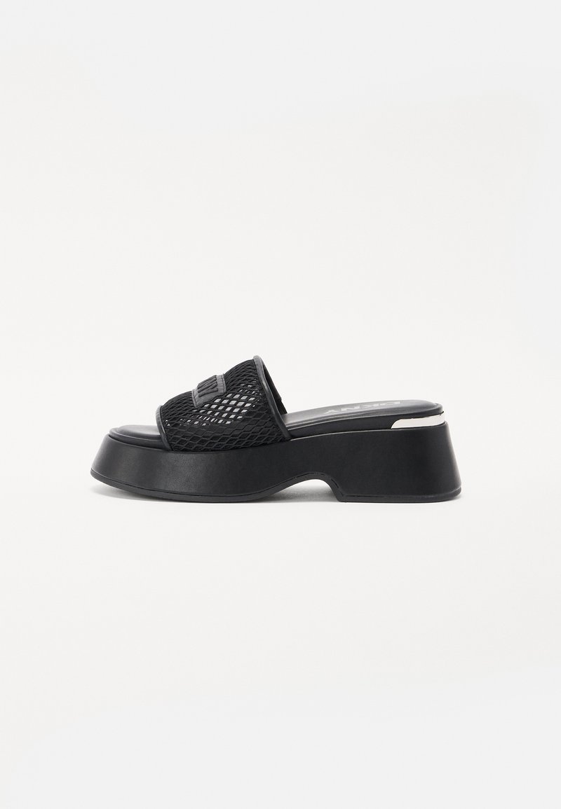 Black platform slide sandal with a textured mesh upper, wide strap, and a sturdy rubber sole. Features a slight heel and smooth footbed.