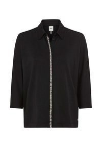 Schwarzes Langarmshirt mit Kragen, halblangen Ärmeln und einer vertikalen Reihe kleiner silberner Verzierungen entlang der Vorderseite.