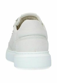 White sneaker with a smooth leather upper, padded collar, and a textured white rubber sole. Features minimal stitching and a clean design.