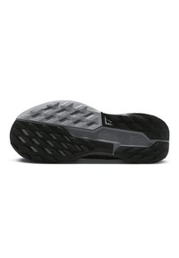 Black and gray sneaker sole with textured rubber. Features multidirectional traction patterns and notable branding on the side.