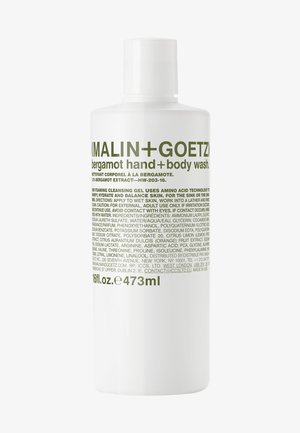 Weiße Flasche mit Bergamot-Hand- und Körperwaschmittel von Malin+Goetz, mit grüner Schrift, einem abgerundeten Deckel und einem eleganten zylindrischen Design. 473 ml Fassungsvermögen.