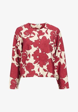 Red floral-patterned button-up blouse on a cream background, featuring a round neckline, long sleeves, and textured fabric.