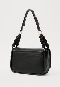 Black leather handbag with a structured design, featuring a braided handle, gold hardware accents, and a flat silhouette.