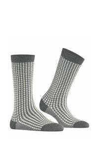 Calze grigie con motivo a scacchi caratterizzate da un design testurizzato con accenti bianchi, bordi a coste e sezioni della punta e del tallone grigie solide.