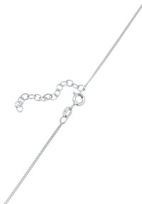 Silver chain bracelet with a smooth texture, featuring a round clasp and a short adjustable extension chain.