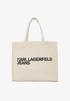 Canvas tote bag i beige med sort tekst "KARL LAGERFELD JEANS." Har slidstærkt stof, dobbelte håndtag og rektangulær form.