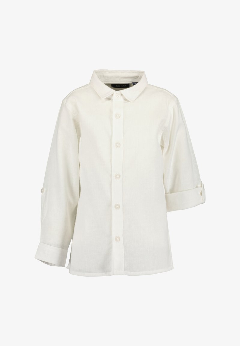 Chemise blanche à manches longues avec col et boutons, manches retroussées maintenues par des pattes à bouton.