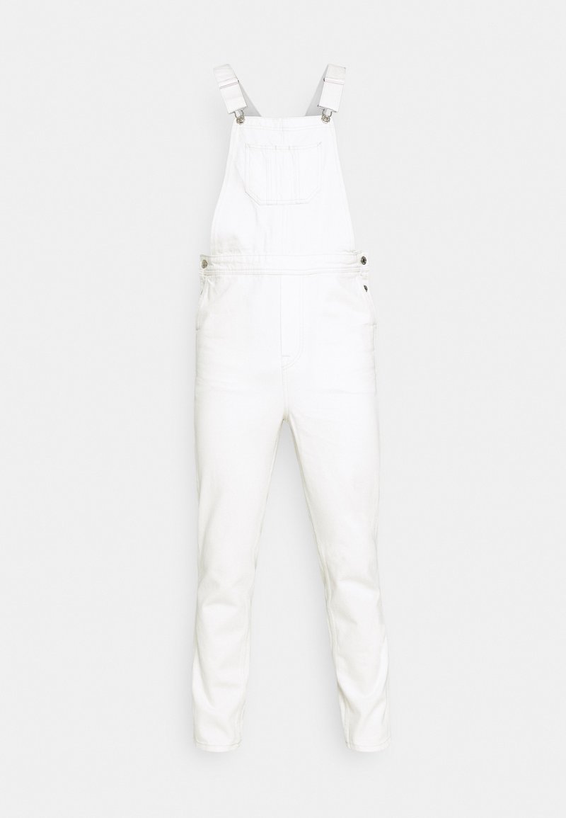 Bílé denimové laclové kalhoty mají nastavitelné popruhy, přední kapsu a boční knoflíky. Látka má hladkou strukturu a minimalistický design.