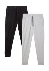 Pantaloni della tuta neri e grigi, con vita elastica, lacci, tasche laterali e caviglie affusolate. Materiale in morbido misto cotone.