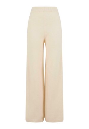 Krém színű, bő szárú nadrág, puha anyagból készült, rugalmas derékkal és texturált bordázott részletekkel a száraknál.