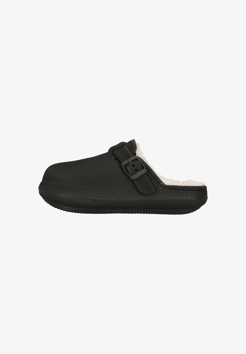 Sort træklodse med en struktureret overdel, pelsfor og justerbar spænde. Rund tå og slip-on design. Flad gummisål.