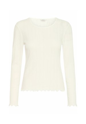 White long-sleeve top made of ribbed fabric, featuring a scalloped hem and neckline. Lightweight with a fitted design and subtle texture.