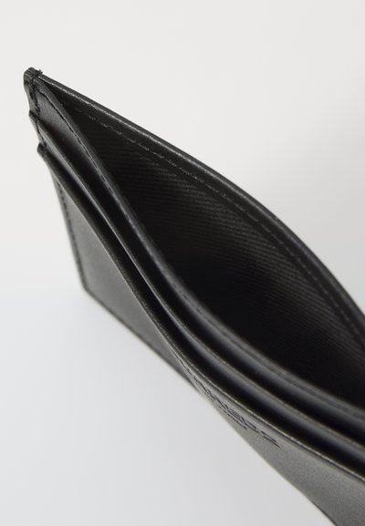 Black leather wallet with a textured exterior, folded design, and visible stitching. Interior shows compartments for cards and cash.