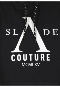 Black hoodie made of cotton blend, featuring a large white "A" logo with "SL ADE COUTURE" and "MCMLXV" printed below. Drawstrings have black and white accents.