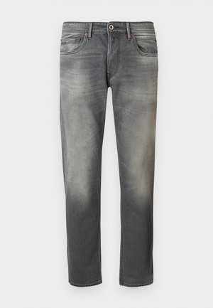 Donkergrijze denim jeans met een vervaagd effect, vijf zakken, een sluiting met een knop aan de voorkant en oranje stiksels langs de naden.