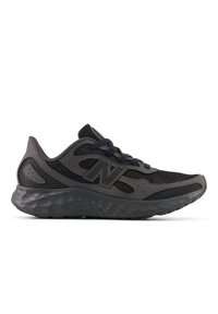 Black and grey athletic shoe with mesh panels, rounded outsole, and textured accents. Features a solid lace closure and side logo.