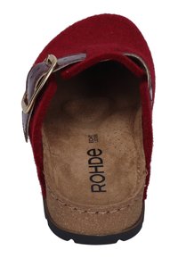 Red felt slip-on shoe with a molded suede insole and a shiny leather buckle detail; contoured footbed for comfort and support.