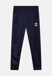 Pantalons de sport bleu marine en tissu lisse et léger. Dotés d'une taille élastique et d'un logo Hummel blanc sur le côté gauche.