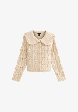 Beige gebreid vest met een geschulpte kraag, een gestructureerd patroon en knoopsluiting. Lange mouwen met geribbelde randen en opengeweven accenten.