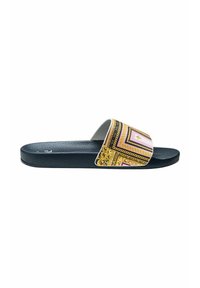 Slide sandal featuring a thick black textured sole and a wide, patterned strap in white with gold, pink, and black geometric designs.