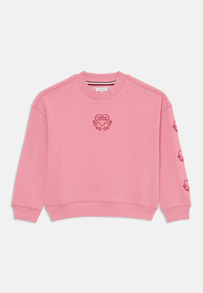 Ružová mikina vyrobená z mäkkej látky, so srdcovým logom "TOMMY HILFIGER" a kvetinovými akcentmi na prednej strane a rukávoch. Rebrované zakončenie a manžety.