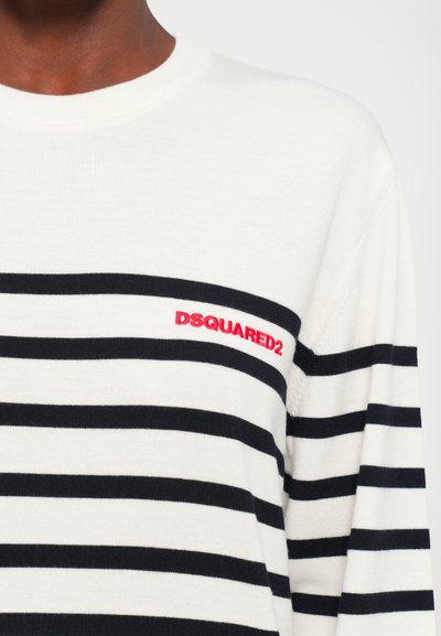 White knit sweater with horizontal black stripes and red "DSQUARED2" logo on the upper chest near the shoulder.