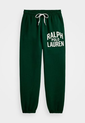 Gröna träningsoveraller med elastisk midja och vit dragsnöre. Funktioner "RALPH POLO LAUREN" tryckt i vitt på vänster ben. Mjuk textur.
