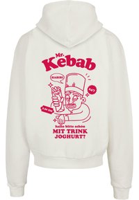 Hvit hettegenser med rosa grafisk design av en kokk som holder en kebab. Teksten inkluderer "Mr. Kebab," "Habibi," og andre setninger.